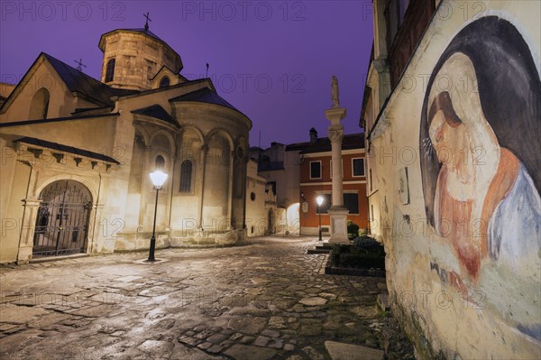 Mural of Virgin Mary by Armenian Cathedral at night in Lviv, Ukraine