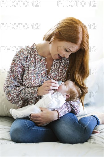 Woman holding her newborn son