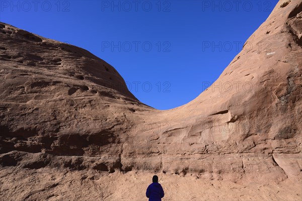 Silhouette of woman by rock formation in Monument Valley, Arizona, USA