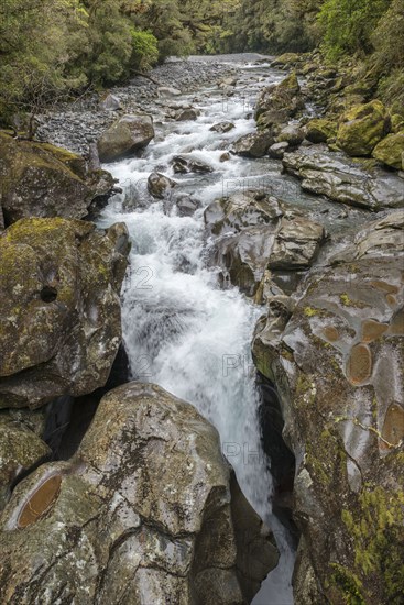 River over rocks in Milford Sound, New Zealand