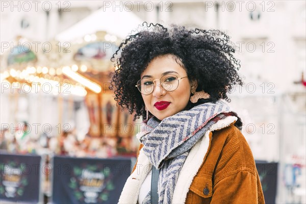 Portrait of young woman wearing glasses and red lipstick