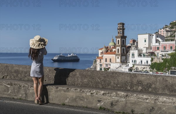 Woman wearing hat by Atrani, Italy