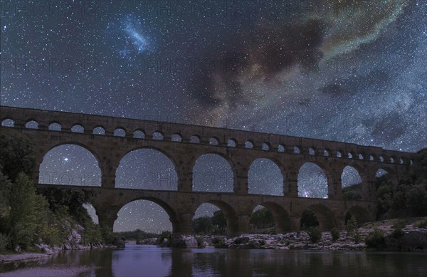 Pont du Gard under starscape at night in Vers-Pont-du-Gard, France