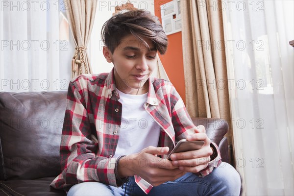 Teenage boy using smart phone