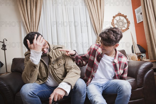 Father and son playing video game