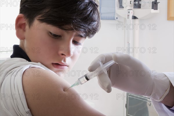 Teenage boy getting vaccination