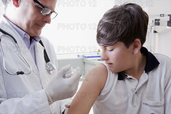 Teenage boy getting vaccination