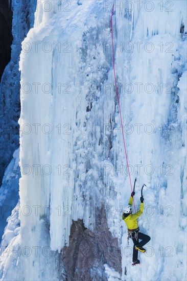 Man ice climbing in Ouray, USA