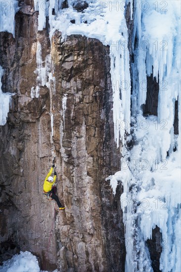 Man ice climbing in Ouray, USA