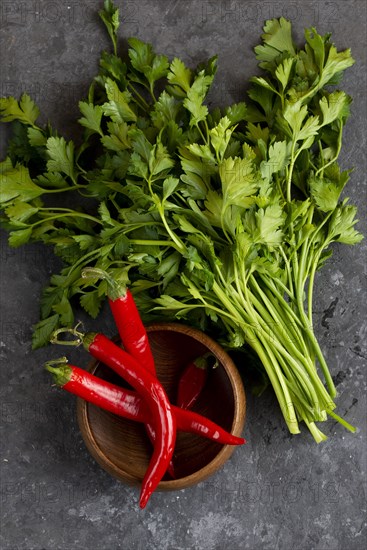 Parsley with chili peppers in bowl