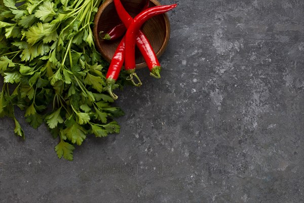 Parsley with chili peppers in bowl