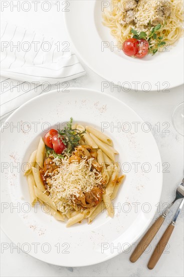 Bowl of pasta topped with cheese