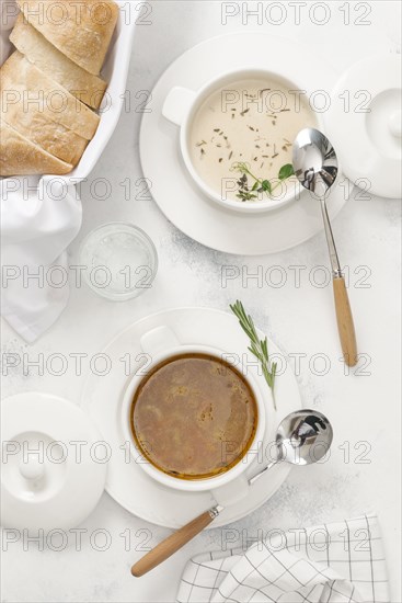 Two types of soup with bread