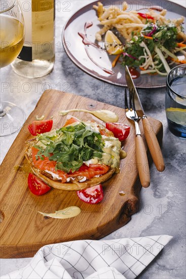 Salmon on bread with arugula