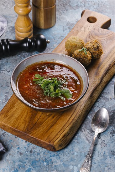 Soup served with falafel balls