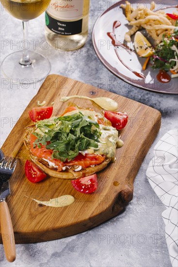 Salmon on bread with arugula