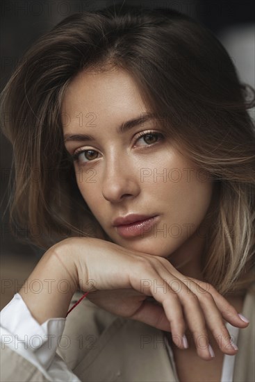 Portrait of young woman wearing natural make-up