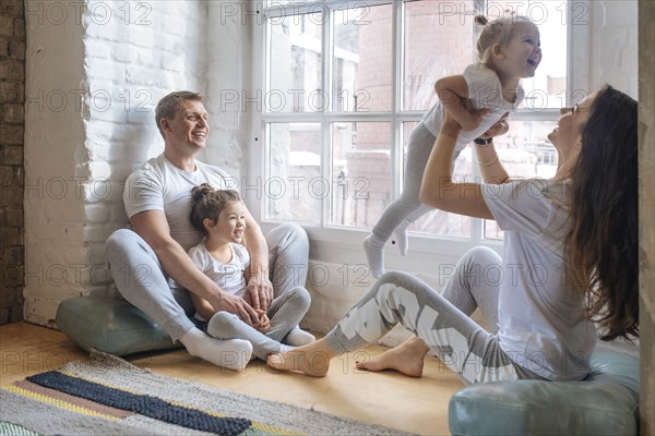 Family sitting by window