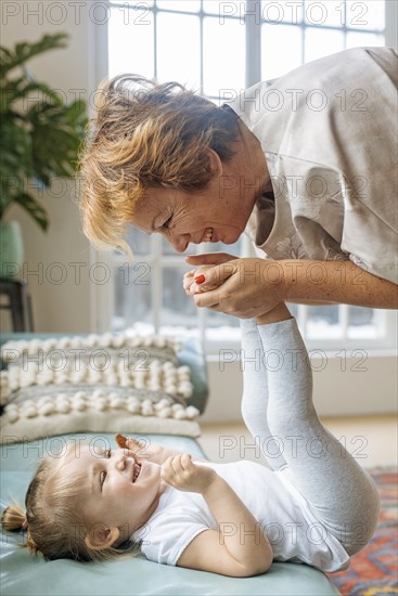 Grandmother playing with granddaughter