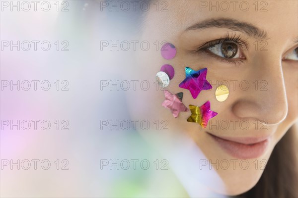 Woman with confetti on cheek