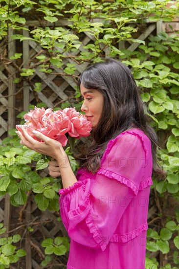 Woman holding bouquet of flowers