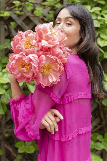 Woman holding bouquet of flowers