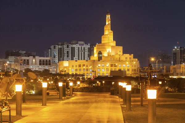 Abdulla Bin Zaid Al Mahmoud Islamic Cultural Center at night in Doha, Qatar