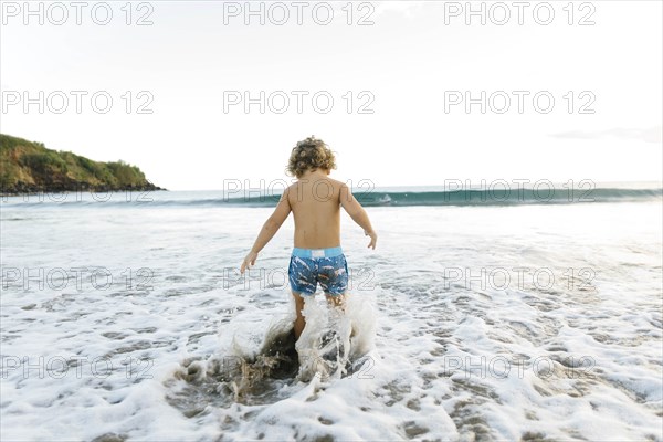 Boy playing on beach