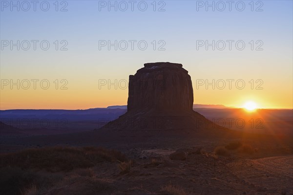 Butte at sunset in Monument Valley, Arizona, USA