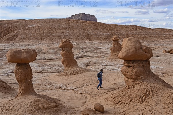 Woman hiking through Goblin Valley State Park, Utah, USA