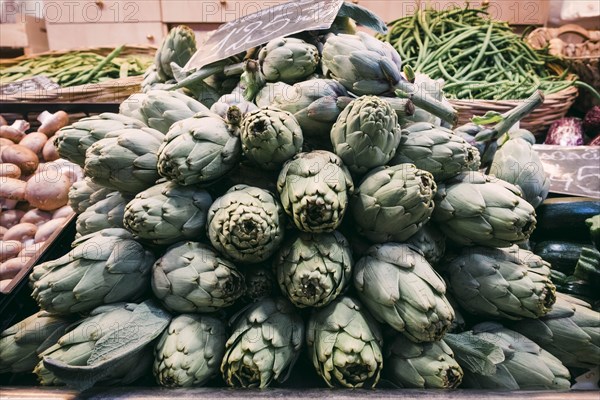 Pile of artichokes in greengrocer's