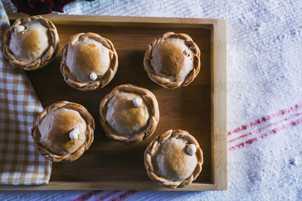 Chicken pies on wooden tray