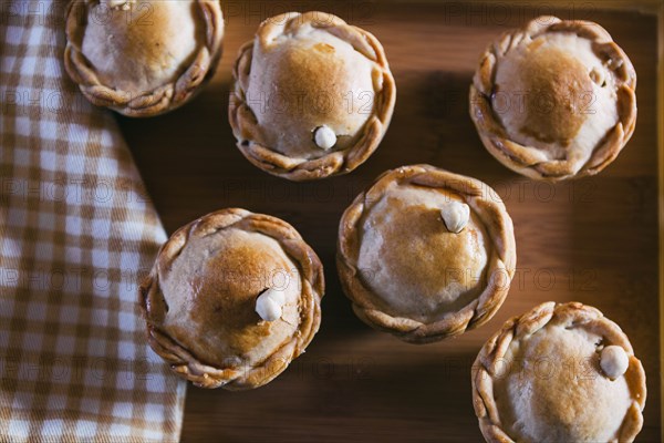 Chicken pies on wooden tray