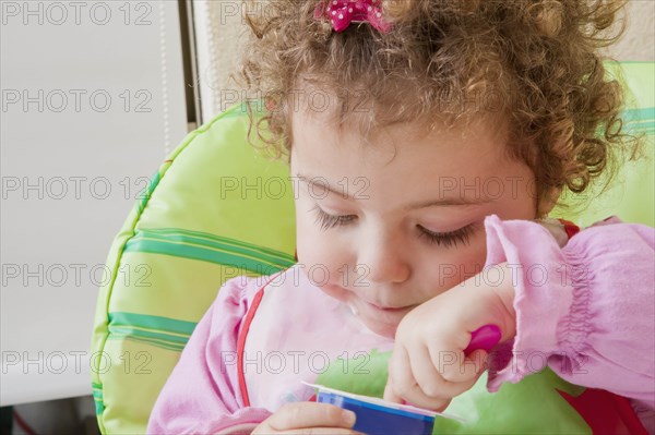 Girl eating yoghurt