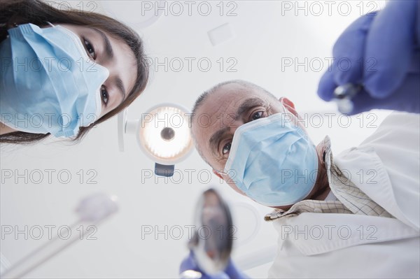 View directly below dental hygienist and dentist during examination