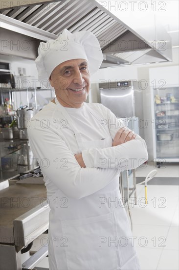 Chef smiling in commercial kitchen