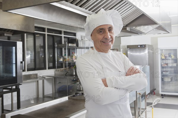 Chef smiling in commercial kitchen