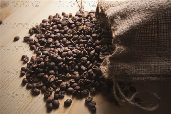 Spilled sack of roasted coffee beans