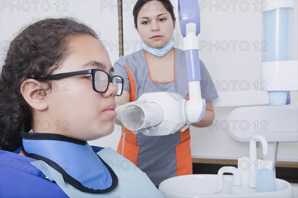 Patient getting X-ray at dentist's surgery