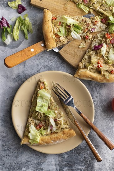 Pizza topped with cabbage