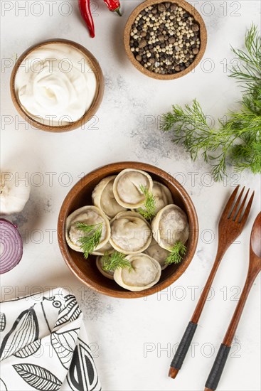 Dumplings in bowl with dill