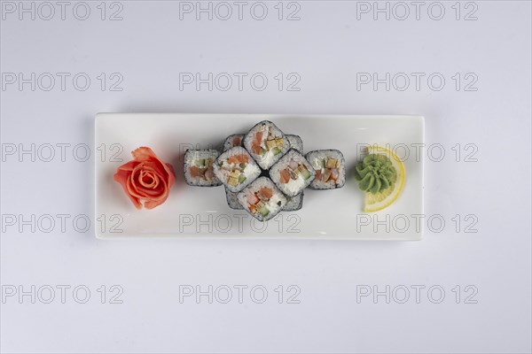Plate of sushi with pickled ginger and wasabi