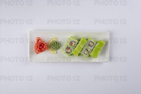 Plate of sushi with pickled ginger and wasabi