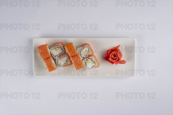 Plate of salmon sushi with pickled ginger