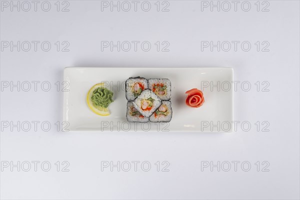 Plate of sushi with pickled ginger and wasabi