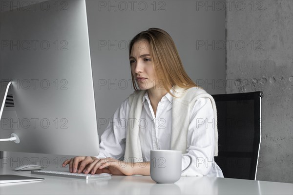 Businesswoman concentrating while working at computer