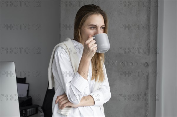 Businesswoman drinking coffee