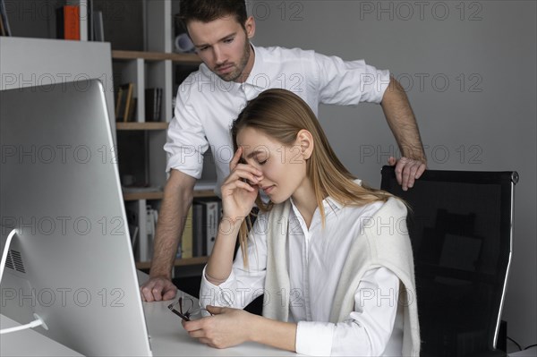 Upset businesswoman and sympathetic colleague