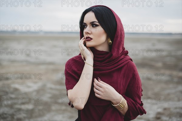 Woman wearing red headscarf and lipstick