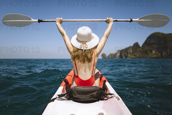 Young woman in kayak on sea in Krabi, Thailand